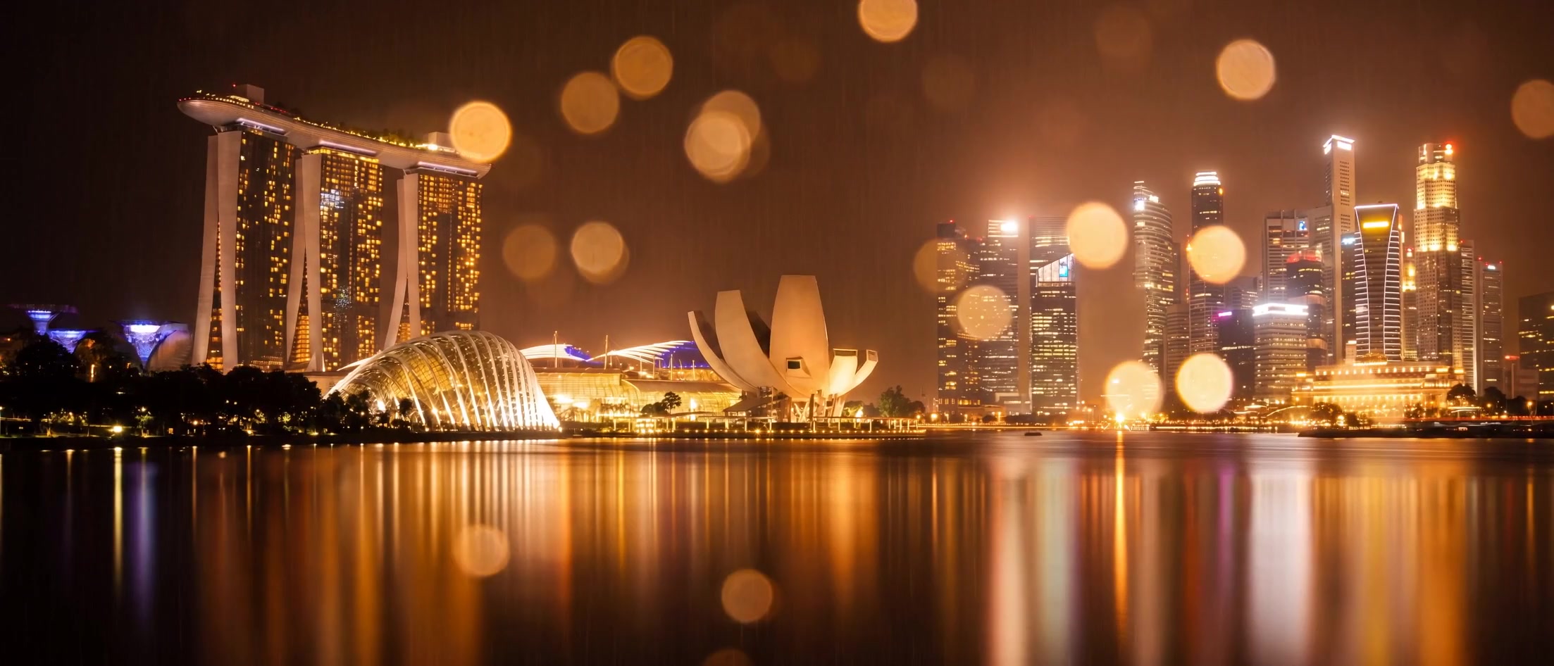 Marina Bay under rain, seen across the water